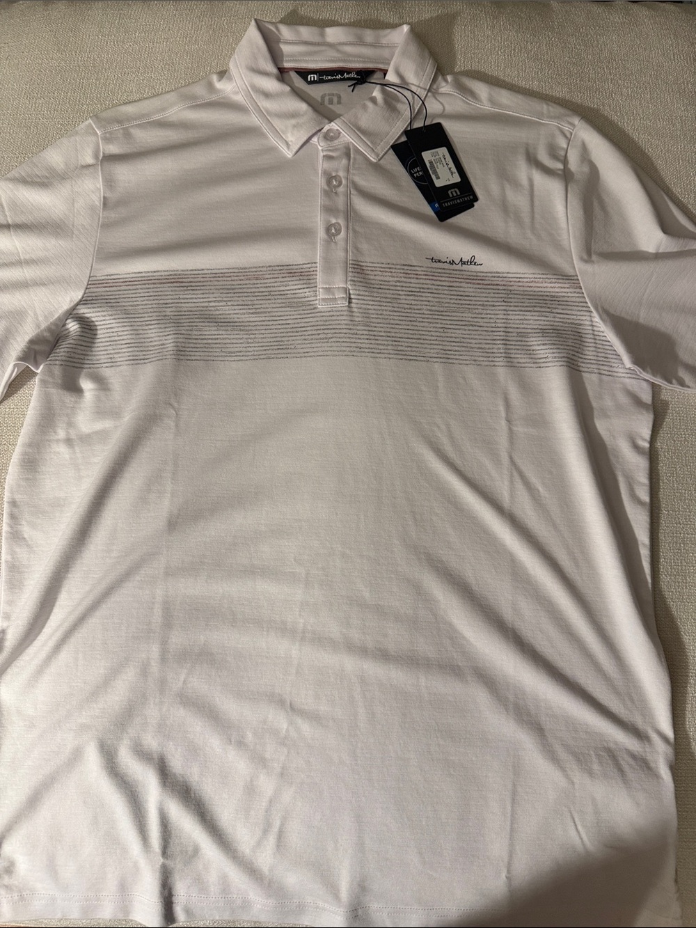 NWT Travis Mathew White Polo with Subtle Gray Stripe Detail